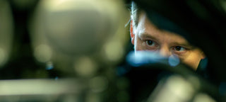 Guy eyes checking on a motorcycles